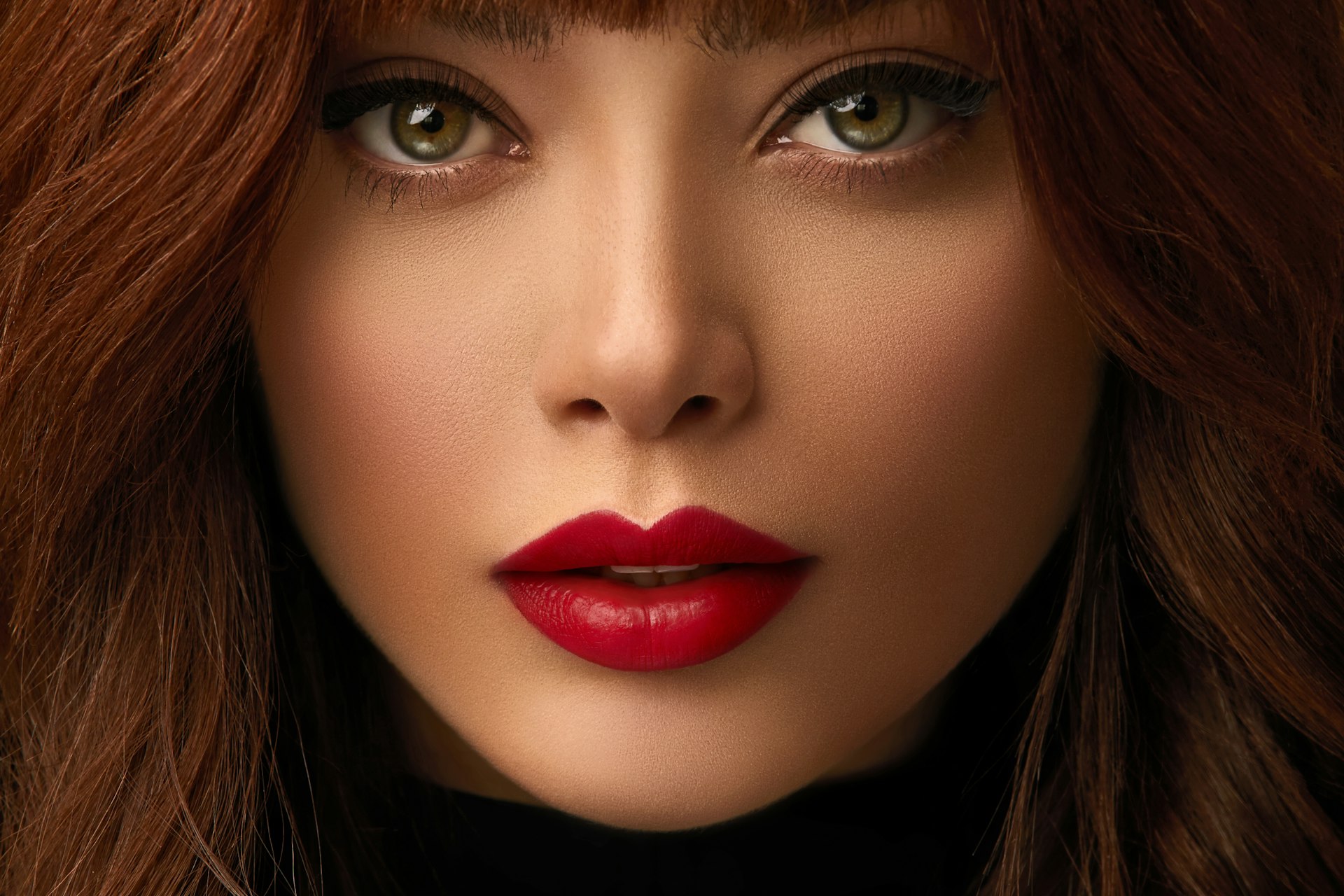 Close-up beauty portrait with bold red lip make-up